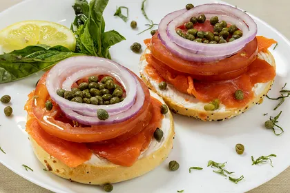 Bagel & Lox Platter — open faced bagel with cream cheese, Alaskan sockeye lox, red onion, tomato and capers