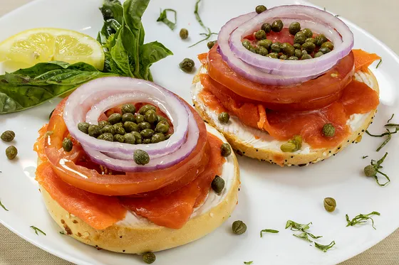 Bagel & lox platter — toasted bagel with cream cheese, Alaskan sockeye lox, red onion, tomato and capers