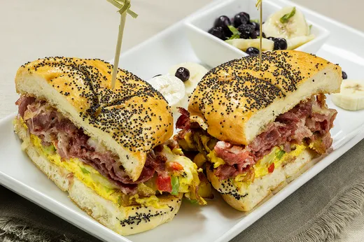 Hash Backwards — scrambled eggs, potatoes, peppers, corned beef and Jack cheese on a grilled poppyseed Kaiser roll
