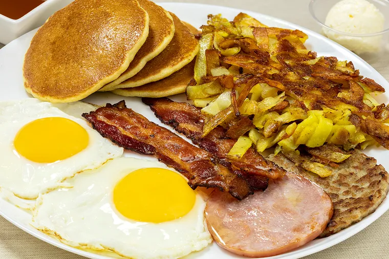 Jacob's Slammin' Platter — two sunny side up eggs, bacon, Canadian bacon, a sausage patty, hash browns and pancakes